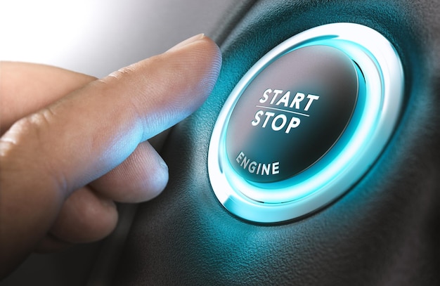 Car stop start system with finger pressing the button, horizontal image