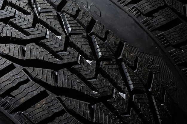 Car tire on black background