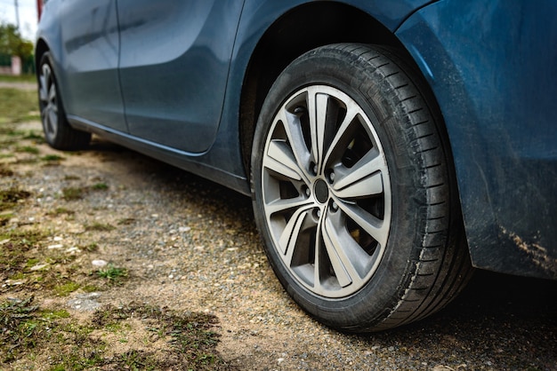 Car tire on gravel road