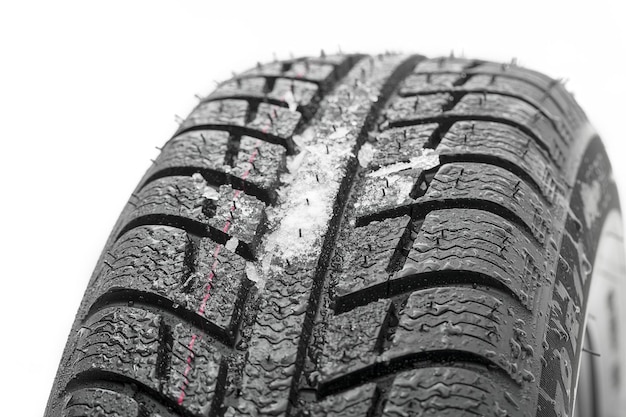Car tires close-up Winter wheel profile structure with snow on white background