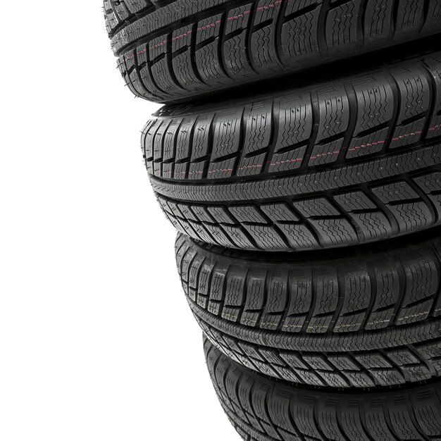 Car tires mature stack close-up Winter wheel profile structure on white background