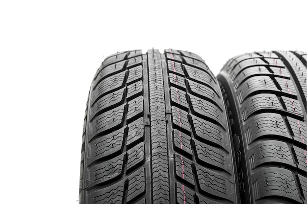 Car tires mature stack closeup Winter wheel profile structure on white background