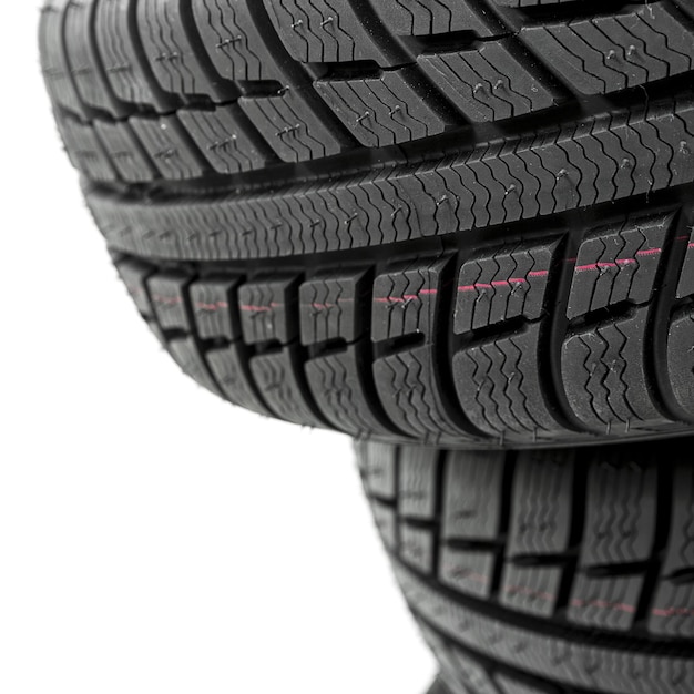 Car tires mature stack closeup Winter wheel profile structure on white background