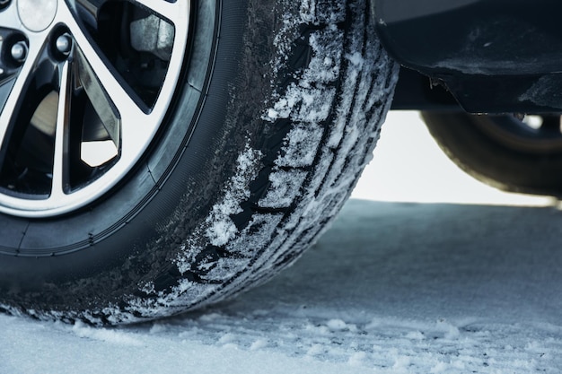 Car tires in shogo Wheel tracks in the snow in winter