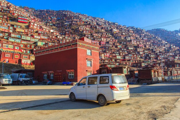 Photo car tour for rent of local guide at larung gar (buddhist academy) in sunshine day