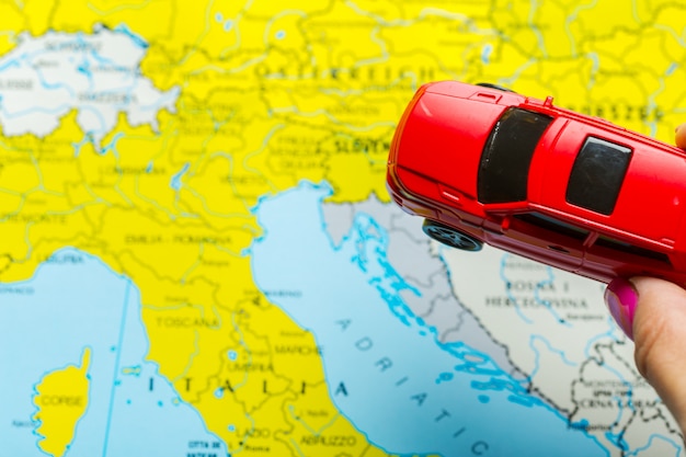 Car toy over europe map