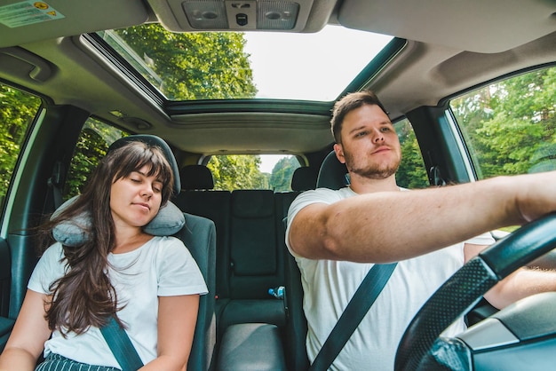 Car travel woman slipping near driver road trip