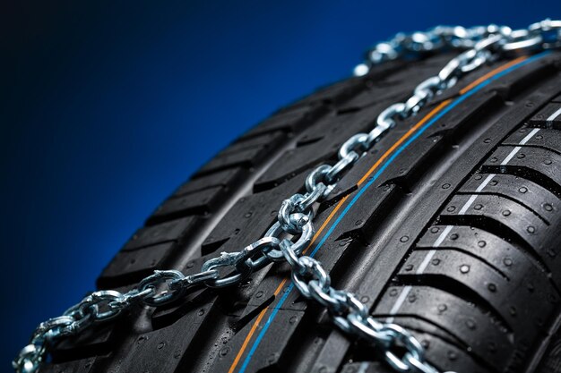 Car tyre with snow chain for winter