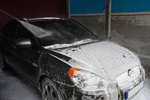 Car wash Cleaning a car with high pressure water at a car wash