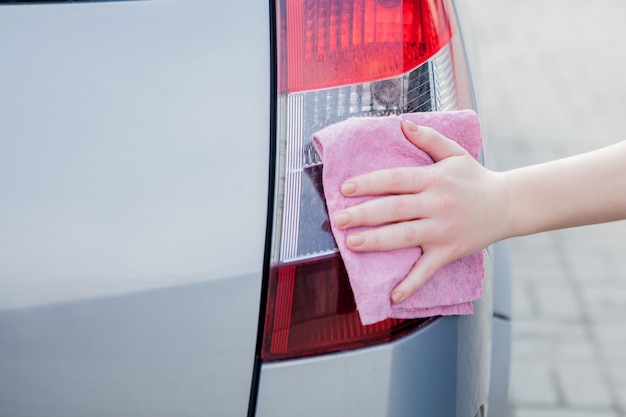 Car wash with foam in car wash station. Carwash. Washing machine at the station. Car washing concept. Car in foam.