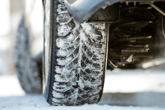 Car wheels rubber tire in deep snow