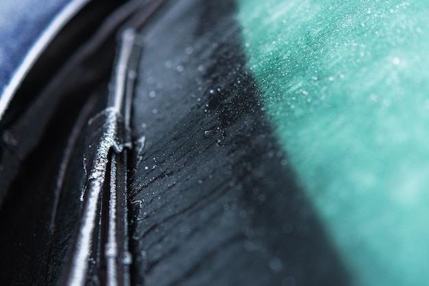 Car Windshield and Wiper Covered by Frost and Ice