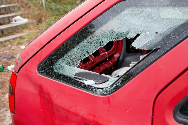 Car with broken windows a criminal incident broken glass window\
car damaged has accident broken glass thief broken glass in car\
window