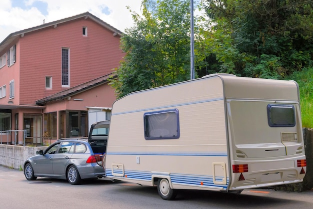 Car with caravan on the road in Switzerland.