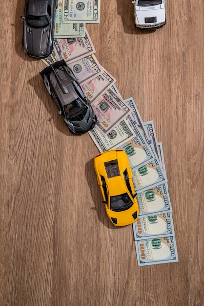 Photo car with money way wooden background