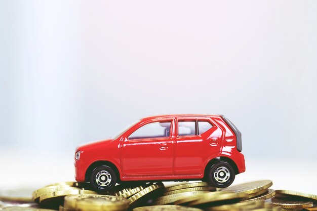 Car with stacked coins no background