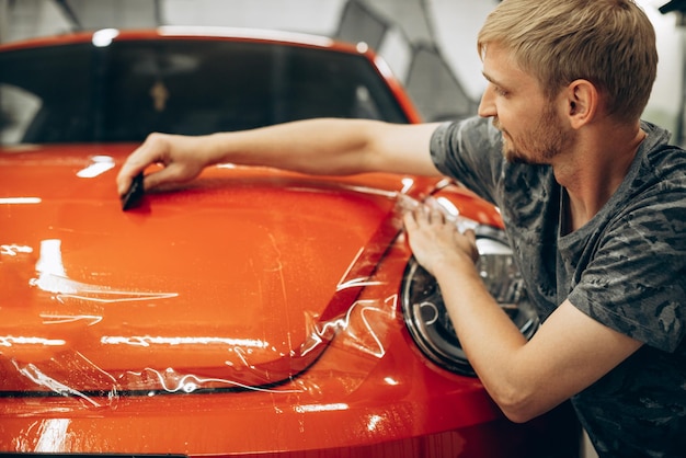 Photo car wrapping with foil at car service