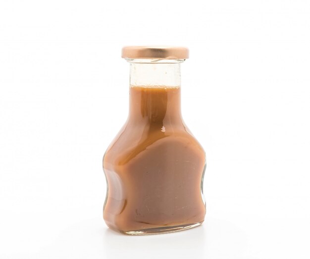 caramel bottle sauce on white 