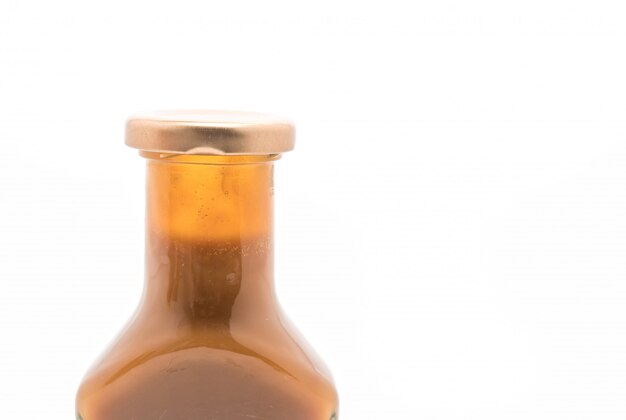 caramel bottle sauce on white 