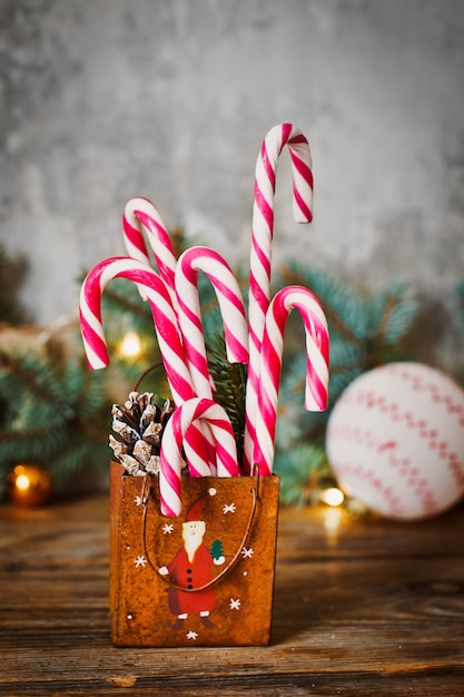 Caramel cane on Christmas background