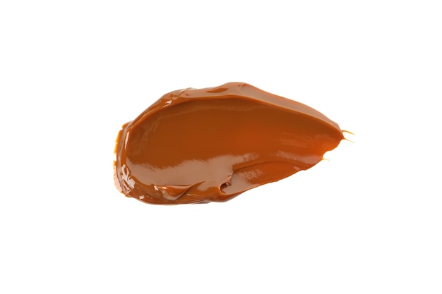 Caramel condensed milk isolated on white surface