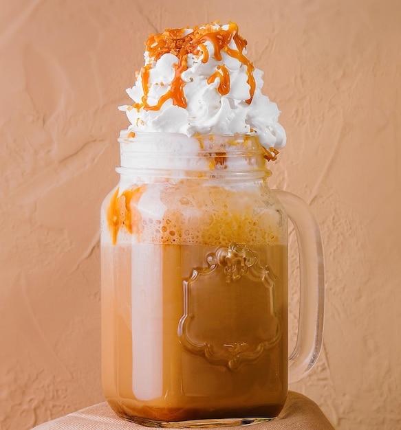 Caramel iced latte with whipped cream