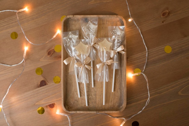 Caramel lollipops in the shape of a star on a wooden table