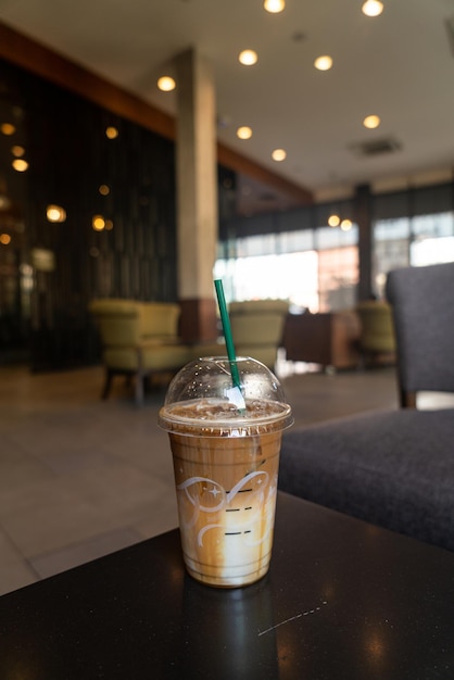 caramel macchiato coffee cup on table in coffee shop