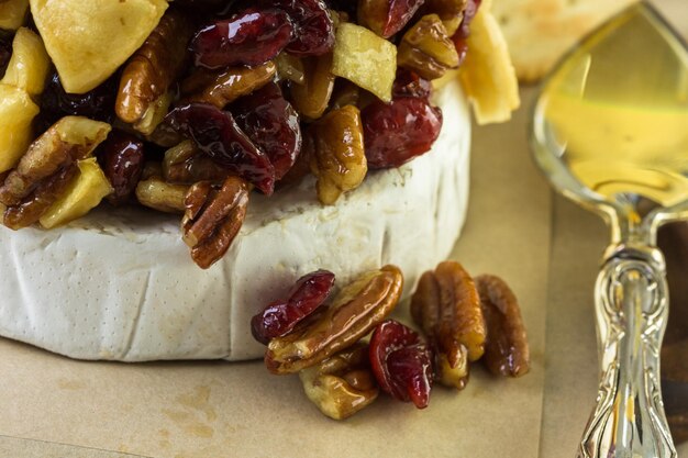 Caramel nut and cranberry brie appetizer for Christmas party.