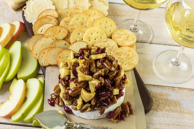 Caramel nut and cranberry brie appetizer for Christmas party.