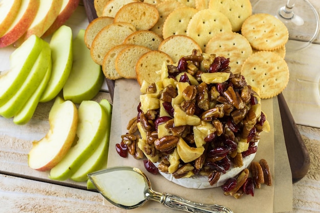 Caramel nut and cranberry brie appetizer for Christmas party.