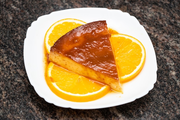 Caramel pudding with lemon slice served in dish isolated on background top view of bangladesh and indian food