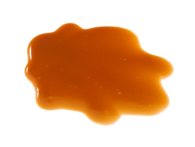 Photo caramel sauce isolated on white background