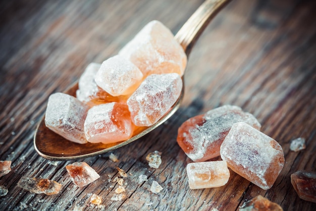 Caramelized brown cane sugar in spoon