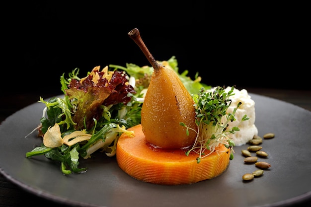 Caramelized pear with pumpkin herbs and seeds