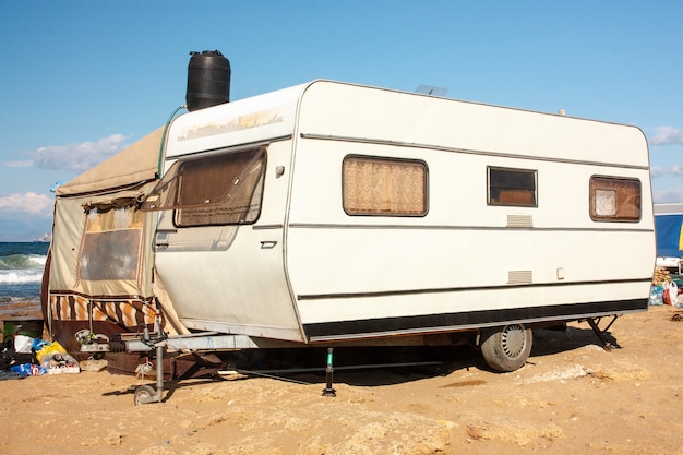 Caravan by the sea against the blue sky