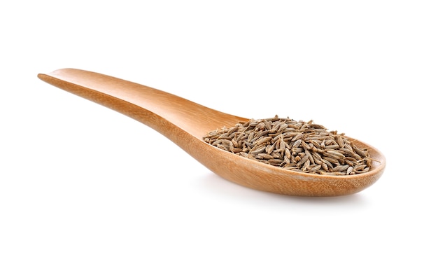 Caraway seeds in wood spoon