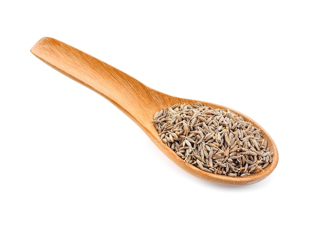 Caraway seeds in wood spoon