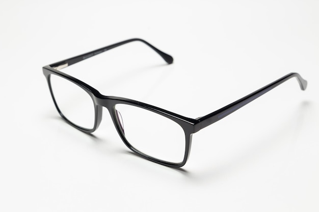 Photo carbon fiber degree glasses in black color side view and white background space for text