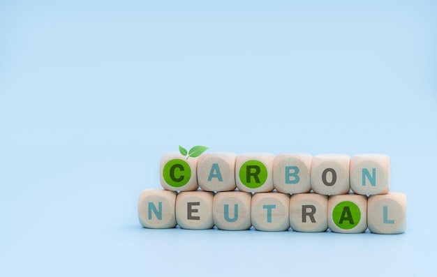 Carbon neutral concept Wooden cubes with carbon neutral words on blue background CO2 neutral banner