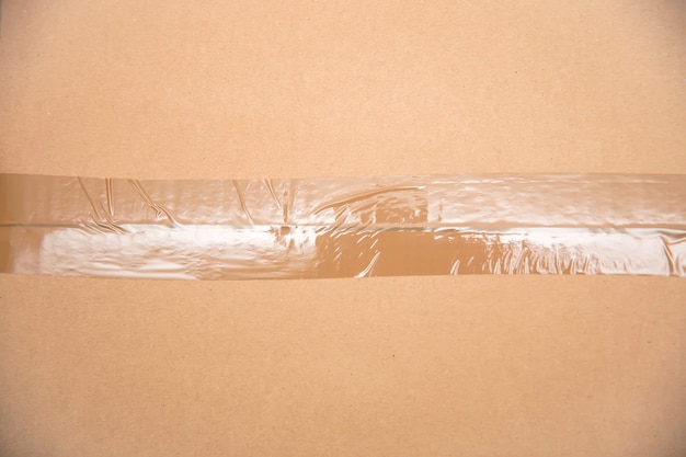 Card board box sealed with transparent packing tape