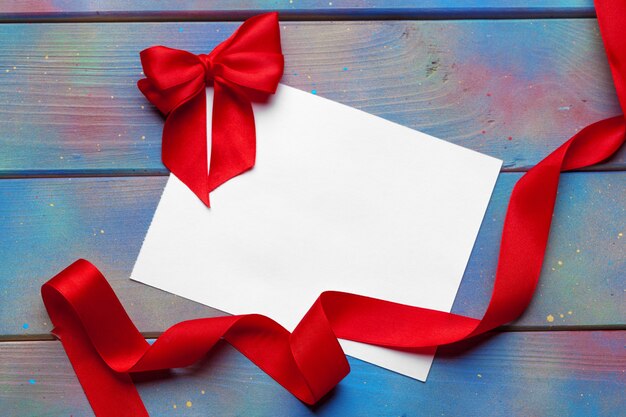 Card with red ribbon