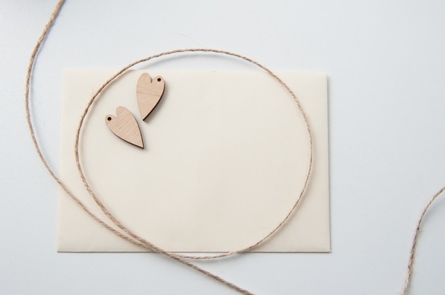 card with wooden hearts and rope