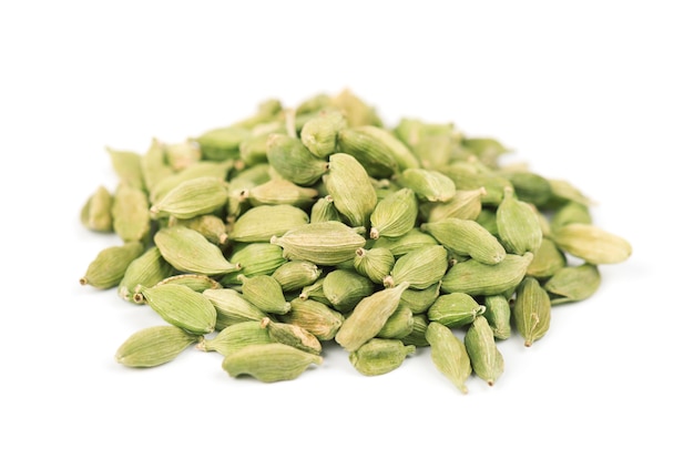 Cardamom seeds isolated on white.