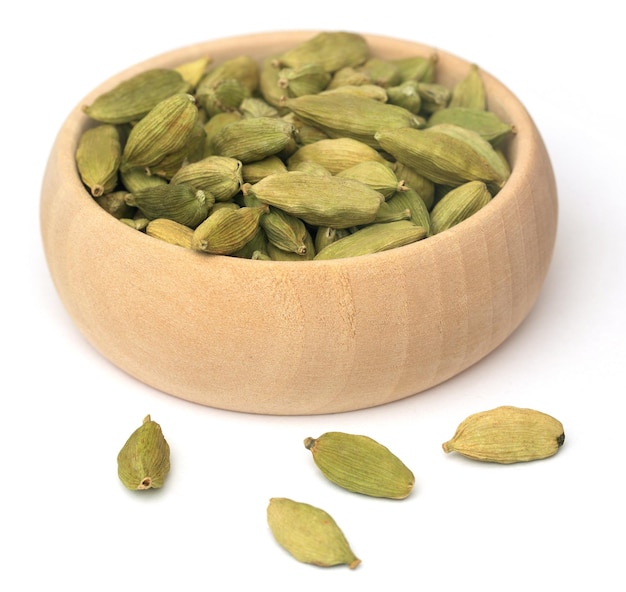 Cardamom seeds in wooden bowl