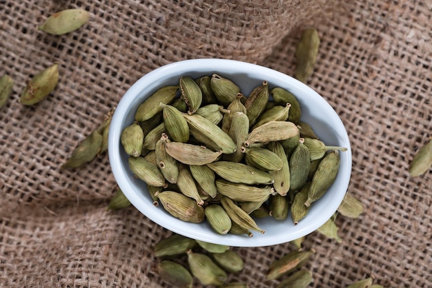 Cardamon Seeds on wooden background