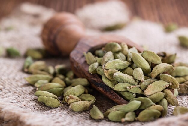 Cardamon Seeds on wooden background