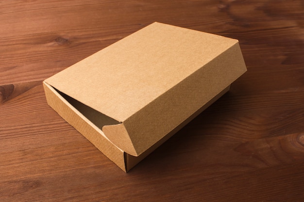 Cardboard box on a dark, wooden