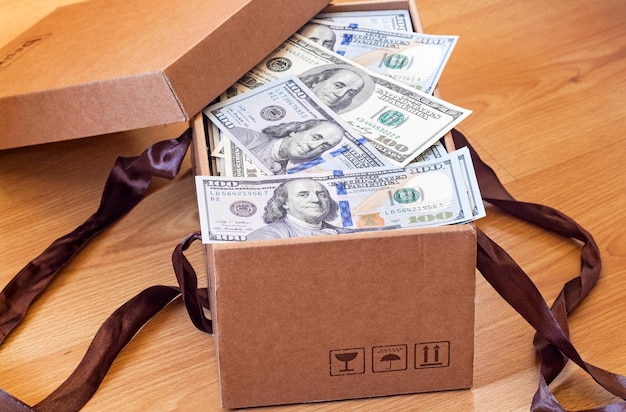 Cardboard box full of dollars banknotes Corruption