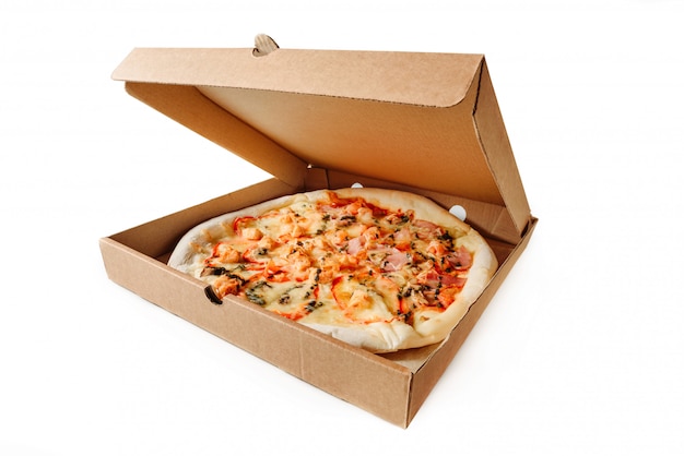 Photo cardboard box with pizza isolated on a white background.